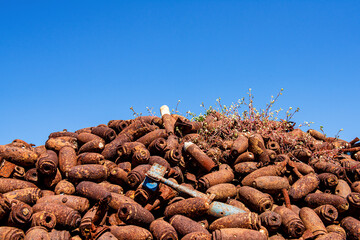 Sad war artifacts and file of old and unexploded bullet and bombs.