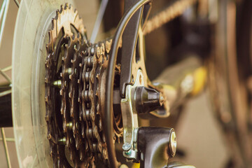 Closeup of a bicycle gears mechanism and chain on the star wheel of mountain bike. Rear wheel cassette from bike. Close up detailed view. Close up bike chains toned