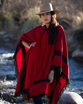 Woman In A Hat And Poncho