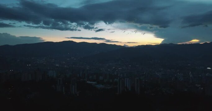 Drone aerial of Medellin city during sunset in Colombia, South america - Dusk time