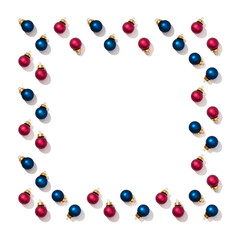 Christmas frame with bright shiny little red and blue round small balls isolated on white background. New Year greeting card.