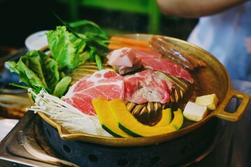 Selective Focus People Enjoy and Dining Dinner Delicious Thai Grilled Barbecue Style (Pork Pan).