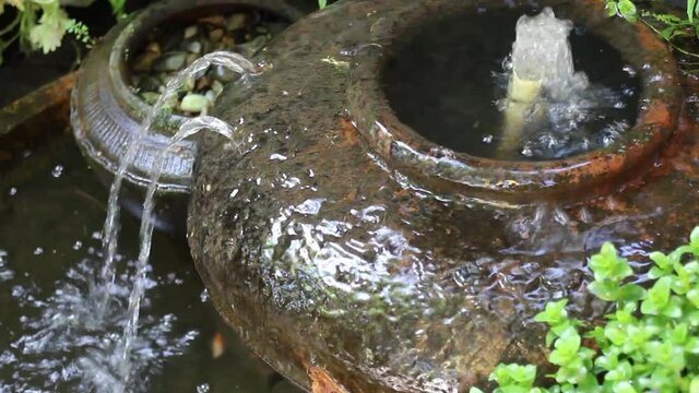 Water fall jar in the garden, stock footage