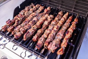 Shish kabob (shashlyk) beef skewers on the gas grill.