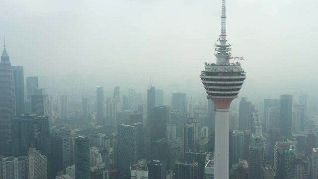 Aerial view of the KL Tower during a foggy day in  Kuala Lumpur. The Kuala Lumpur Tower is a communications tower located in Kuala Lumpur, Malaysia