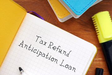 Financial concept about Tax Refund Anticipation Loan with sign on the sheet.