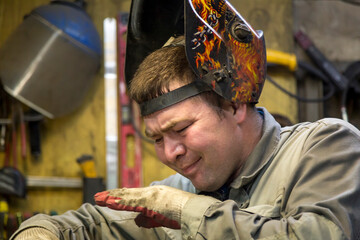 Close-up portrait of a welder in the workplace