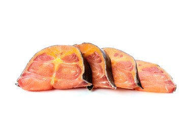 Fresh fish fish steak cut into separate pieces on white background
