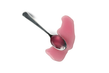 Spoon with syrup isolated on white background