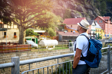 men is standing and watching to mountain in village