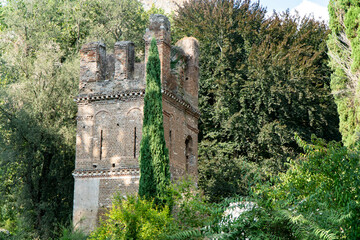 Garden of Ninfa and ruins of the medieval city Ninfa in Italy in the province of Latina - obrazy, fototapety, plakaty