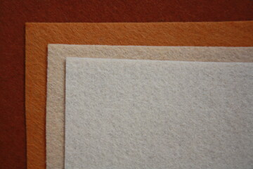 Fototapeta premium Texture of brown felt fabric. Grunge background.