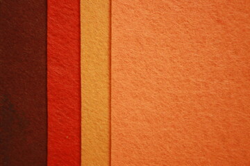 Texture of orange felt fabric. Grunge background.
