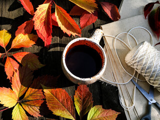 up of coffee with autumn leaves