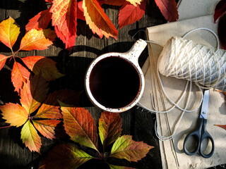 up of coffee with autumn leaves