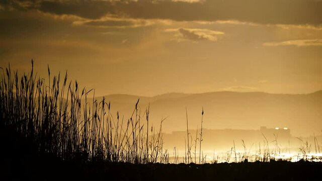 Dark clouds at sunset over sea beach. Nature, coastal landscape. Capi Corb, Mediterranean coast of Spain.