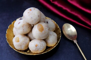 Rawa Ladu, Rava coconut Laddu or Semolina balls. It's a sweet dish from Maharashtra, India. Made using semolina, coconut & sugar. Its famous for festivals like,  Diwali, Dussehra, Navratri. copy space
