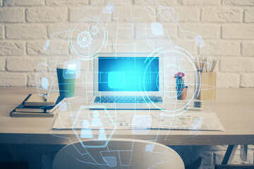 Computer on desktop with social network hologram. Multi exposure. Concept of international people connections.