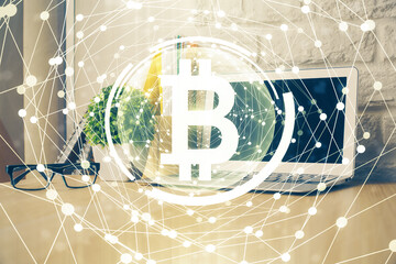 Double exposure of blockchain theme hologram and table with computer background. Concept of bitcoin...