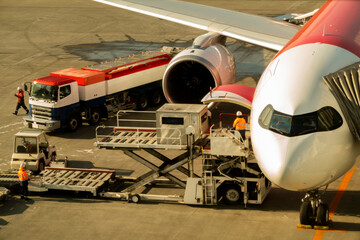 Airplane loaded with baggage preparing  take off at airport