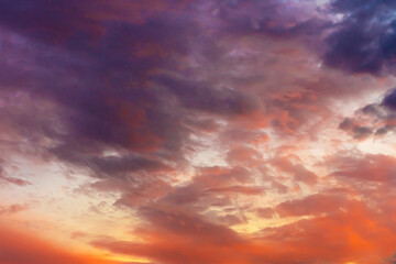 Naklejka na ściany i meble Clouds in the sky. Clouds at sunset. Sunset. The sky at sunset. Multi-colored clouds at sunset. Dark sky with clouds. Thick vapor texture. Natural abstraction. High in the sky. Dramatic background