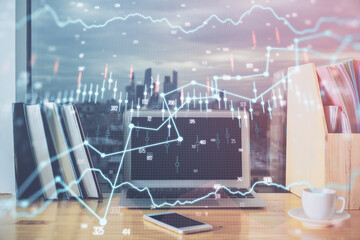 Financial market graph hologram and personal computer on background. Multi exposure. Concept of forex.