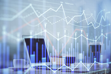 Forex Chart hologram on table with computer background. Multi exposure. Concept of financial markets.