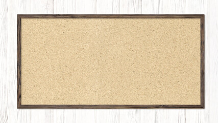 Fototapeta premium Cork board hung on a white wooden wall