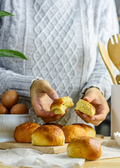 Fresh bun, kitchen utensils and eggs wooden background, homemade bakery presence of a human.