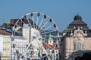 Bratislava Ferris wheel with  reduta concert hall and TV tower in the distance