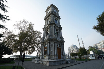 Fototapeta na wymiar Exterior Neoclassical architecture and clock tower design of 'Dolmabahce imperial palace' located along the European shore of the Bosphorus Strait- Istanbul, Turkey