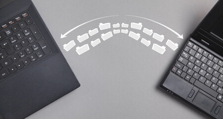 Laptop file transfer. Concept of information exchange