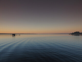 Sunset, summer, beautiful sky. Pier on the big Kama river. Ural, Russia, Perm Territory, Elovo.