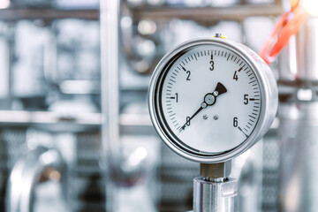 Pressure gauges mounted on the pipeline.