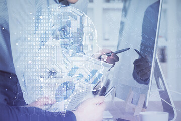 Man with computer background with brain theme hologram. Concept of brainstorm. Double exposure.