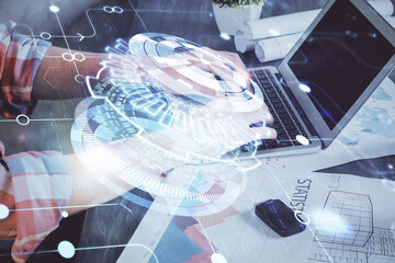 Multi exposure of technology hologram with man working on computer background. Concept of big data.