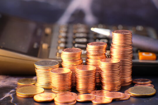 close up of coins on black background, coins stacked background and advertising coins of finance and banking concept
