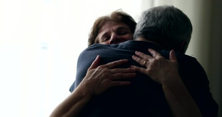 Senior wife hugging husband in support and empathy