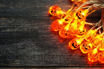 Halloween Holiday Background with LED pumpkin Decoration on wooden background