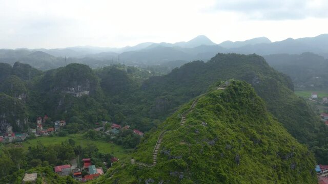 Aerial landscape: Ancient wall of The Mac dynasty as known as Northern Mac or House of Mac, old ruins located on a mountain with panoramic city Lang Son backwards, Vietnam.