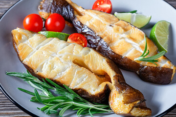 Wild-caught smoked halibut fish steaks on a plate © myviewpoint
