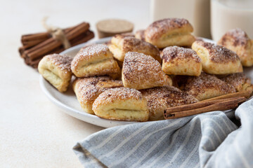 Triangles or angles cottage cheese cookies with sugar and cinnamon. Crows feet cookies. Ideas for children dessert or snack.