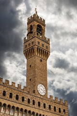 Fototapeta premium Florence, clock tower of the Palazzo Vecchio (1299) called Torre di Arnolfo, Piazza della Signoria, UNESCO world heritage site, Tuscany, Italy, Europe.