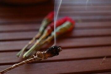 burning homemade herbal incense sticks - obrazy, fototapety, plakaty