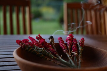 burning homemade herbal incense sticks - obrazy, fototapety, plakaty