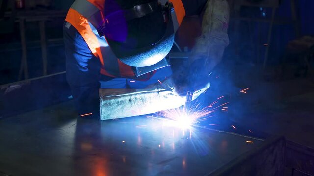 A male engineer is working in an industrial factory.