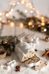 Christmas stollen on wooden background. Traditional Christmas festive pastry dessert. Stollen for Christmas