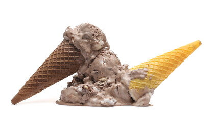 Chocolate and vanilla ice cream balls with yellow and brown cones dropped on floor isolated on white background