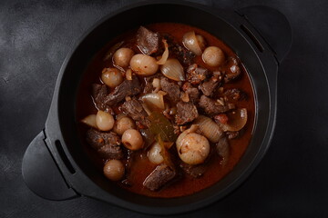 Greek beef stifado. Stew with beef, onion bulbs, cinnamon and spices 
