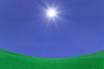 Obraz premium 緑の草原と太陽